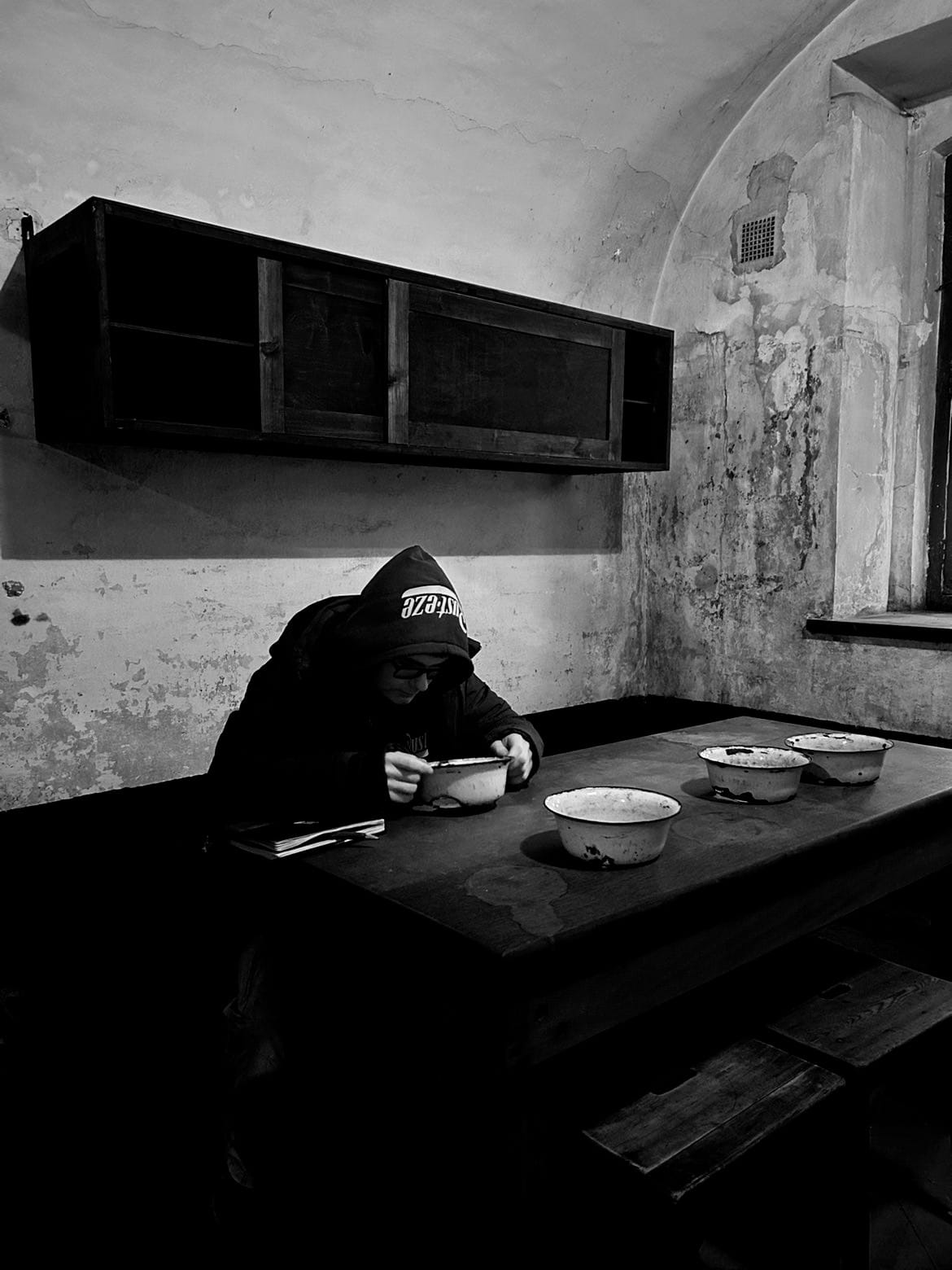 The meager food rations or the kitchen where meals were prepared. Hunger was a constant companion, used as a tool to weaken and control the inmates.