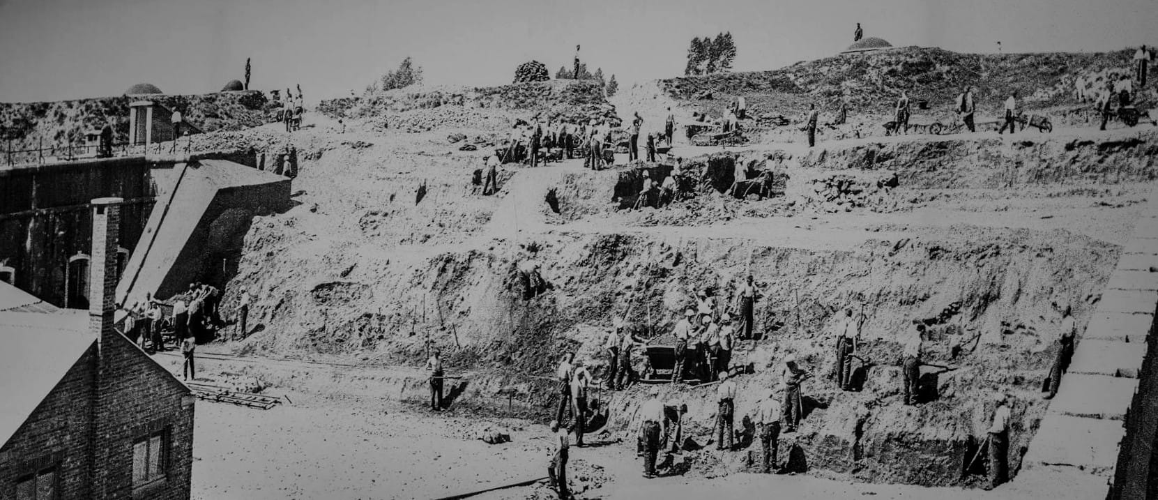 Prisoners forced to perform hard labor. This pointless, backbreaking work was designed to exhaust and break the spirit of those held captive.